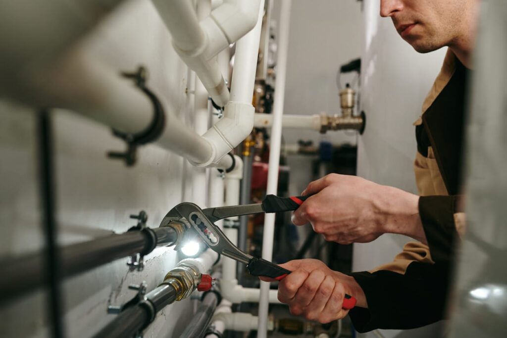 Plumbers maintaining commercial plumbing pipes in Wellington